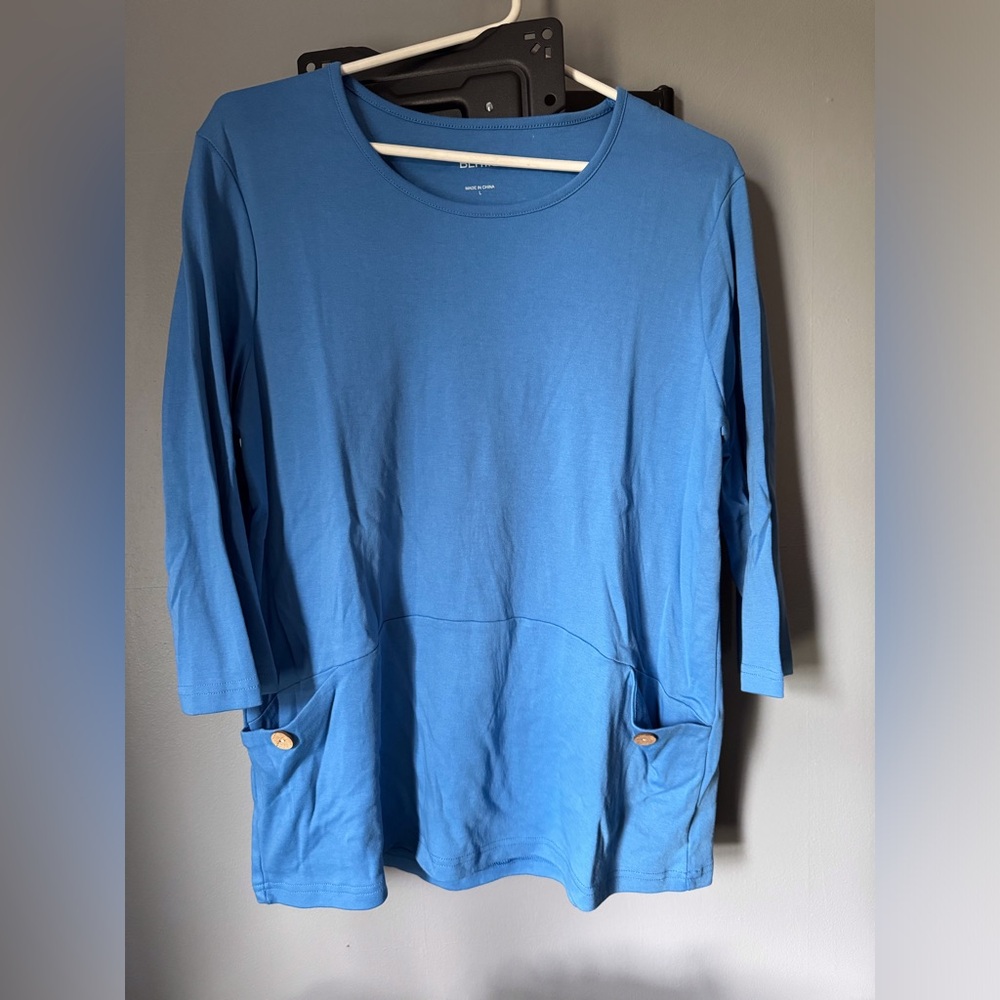 Women’s size large, light blue three-quarter sleeve top